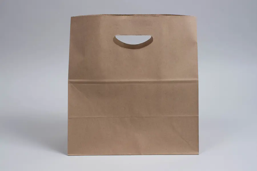 11 X 6-1/4 X 11-1/2 NATURAL KRAFT DIE-CUT HANDLE SHOP BAG