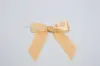 3" X 2-3/4" SATIN GOLD PRE-TIED BOW CLEAR TWIST TIE